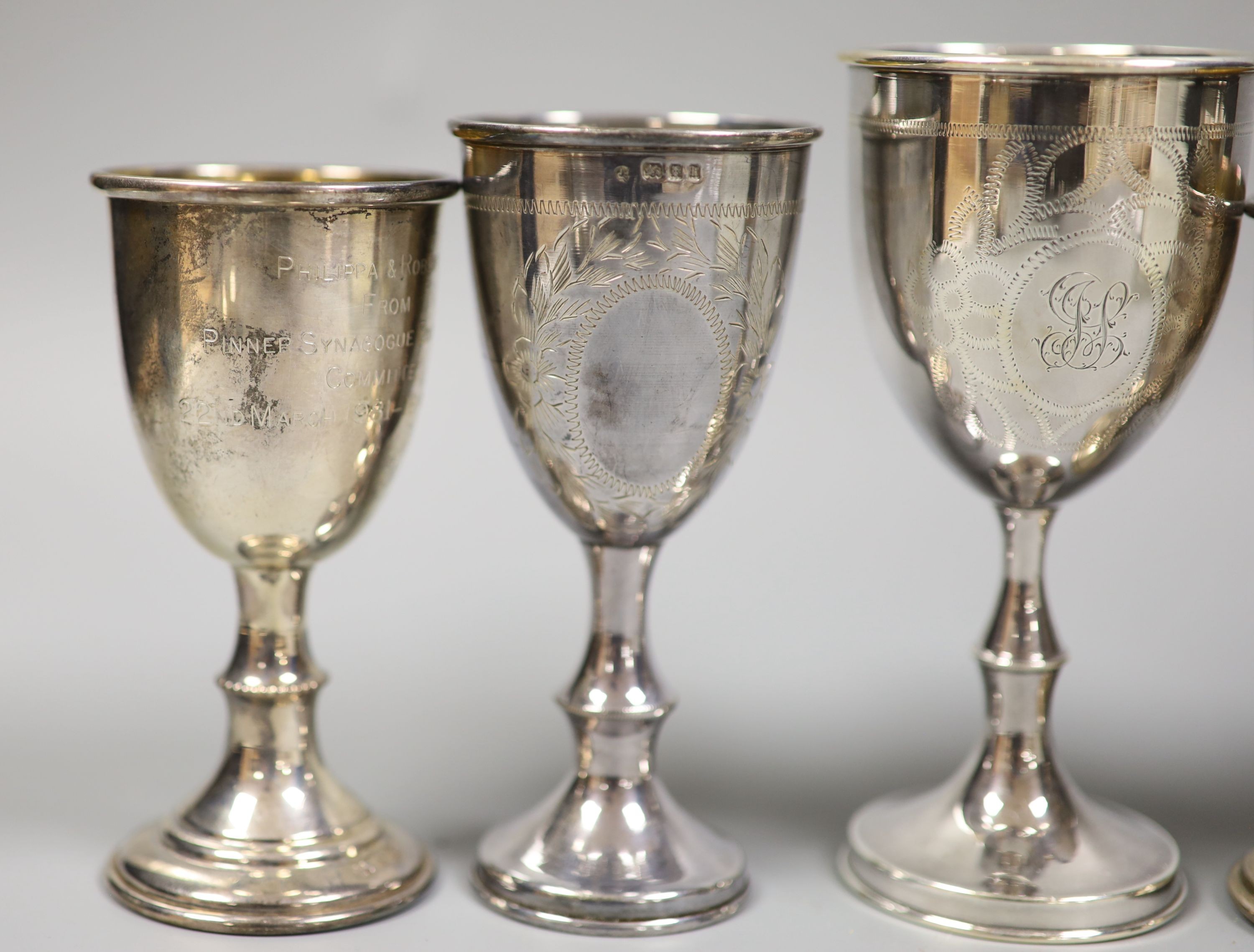 A silver kiddush cup, four other silver goblets and a late Victorian silver two handled dish, 13oz.